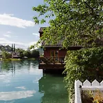 - House By The River